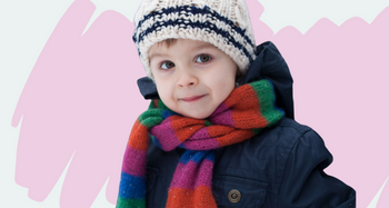 Boy outside in winter hat and scarf